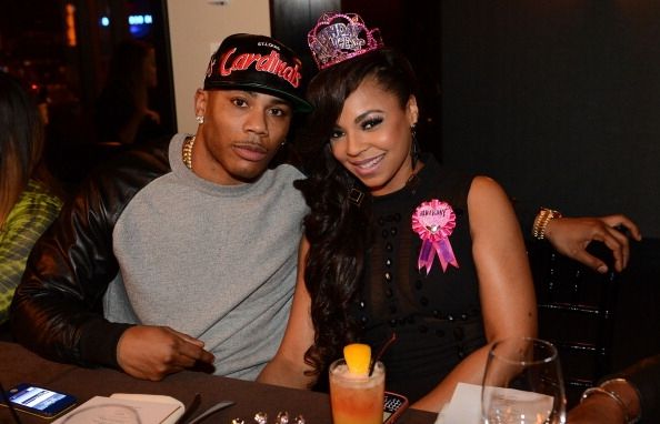 Nelly y Ashanti en su cena de 2012 de cumpleaños sorpresa.