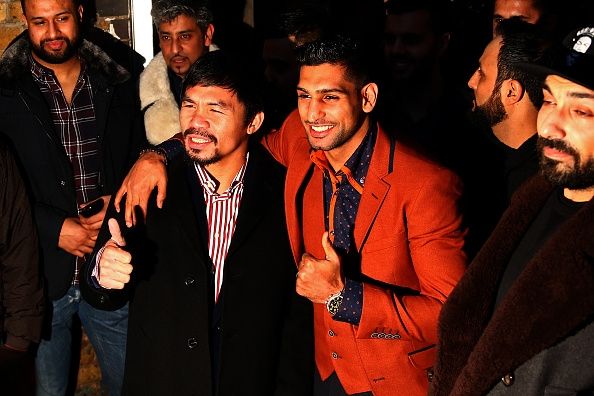 Manny Pacquiao y Amir Khan en Fiztroy Logia Amateur Boxing Club. Manny Pacquiao y Amir Khan en Fiztroy Logia Amateur Boxing Club.